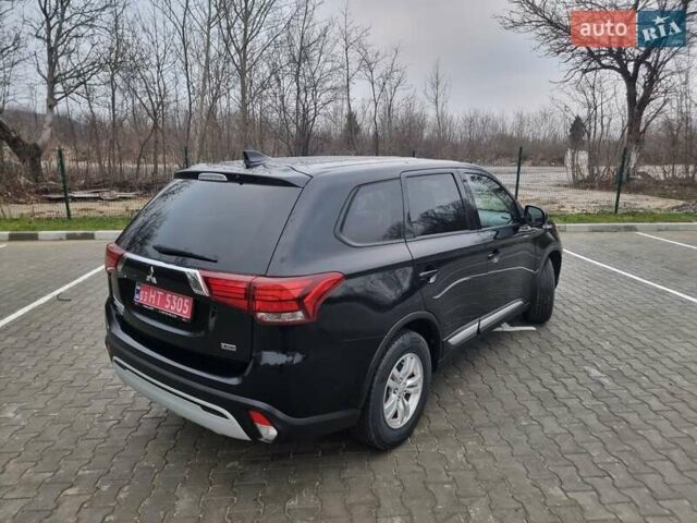 Черный Мицубиси Аутлендер, объемом двигателя 2.36 л и пробегом 127 тыс. км за 20800 $, фото 5 на Automoto.ua