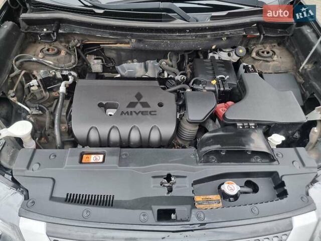 Черный Мицубиси Аутлендер, объемом двигателя 2.36 л и пробегом 127 тыс. км за 20800 $, фото 48 на Automoto.ua