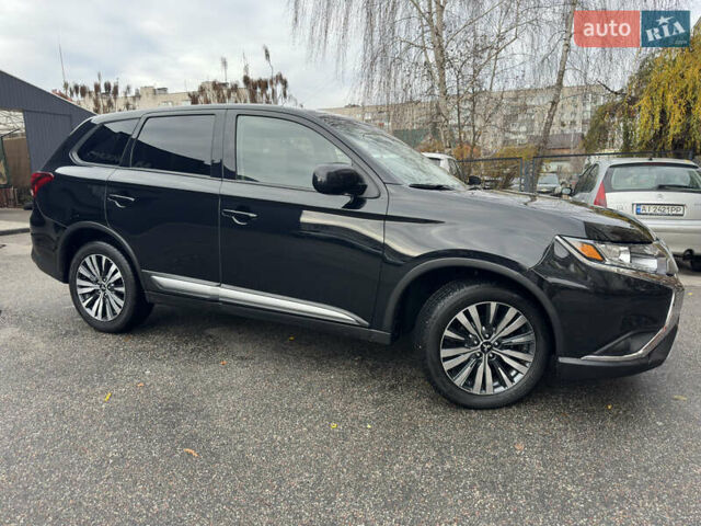 Черный Мицубиси Аутлендер, объемом двигателя 2.4 л и пробегом 44 тыс. км за 18700 $, фото 1 на Automoto.ua