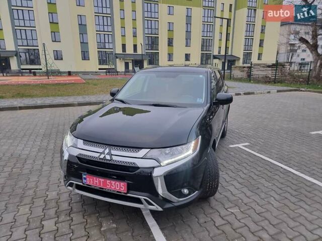 Черный Мицубиси Аутлендер, объемом двигателя 2.36 л и пробегом 127 тыс. км за 20800 $, фото 3 на Automoto.ua