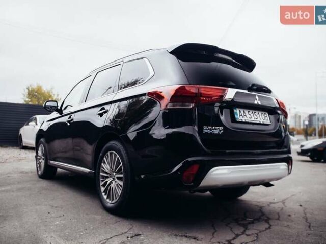 Черный Мицубиси Аутлендер, объемом двигателя 2.36 л и пробегом 110 тыс. км за 28900 $, фото 1 на Automoto.ua