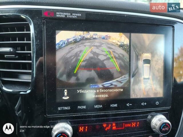 Черный Мицубиси Аутлендер, объемом двигателя 2.36 л и пробегом 50 тыс. км за 21000 $, фото 1 на Automoto.ua