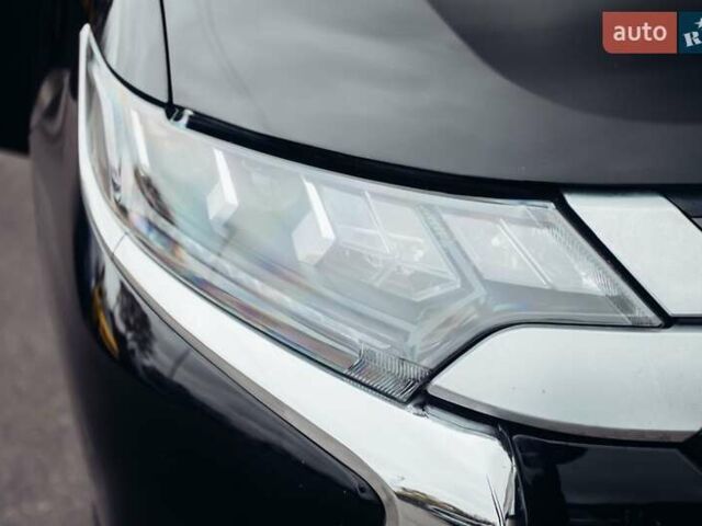 Черный Мицубиси Аутлендер, объемом двигателя 2.36 л и пробегом 110 тыс. км за 28900 $, фото 18 на Automoto.ua