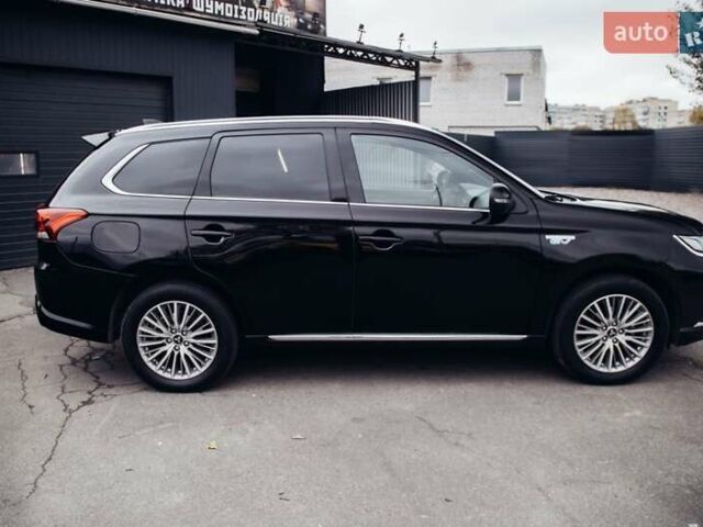 Черный Мицубиси Аутлендер, объемом двигателя 2.36 л и пробегом 110 тыс. км за 28900 $, фото 8 на Automoto.ua