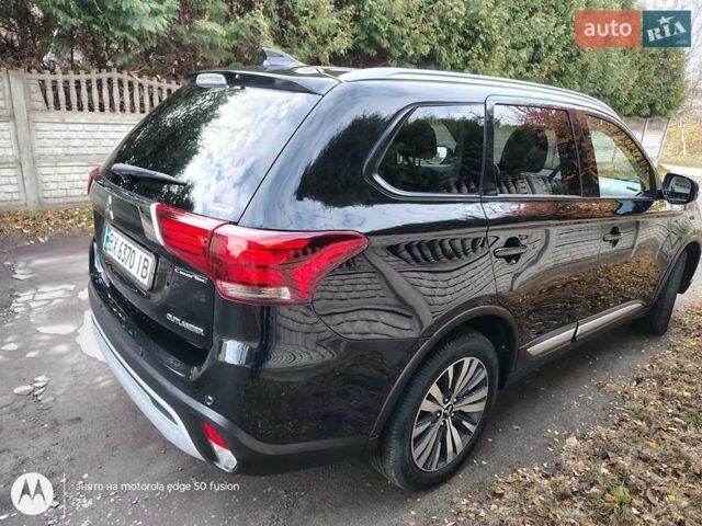 Черный Мицубиси Аутлендер, объемом двигателя 2.36 л и пробегом 50 тыс. км за 21000 $, фото 6 на Automoto.ua