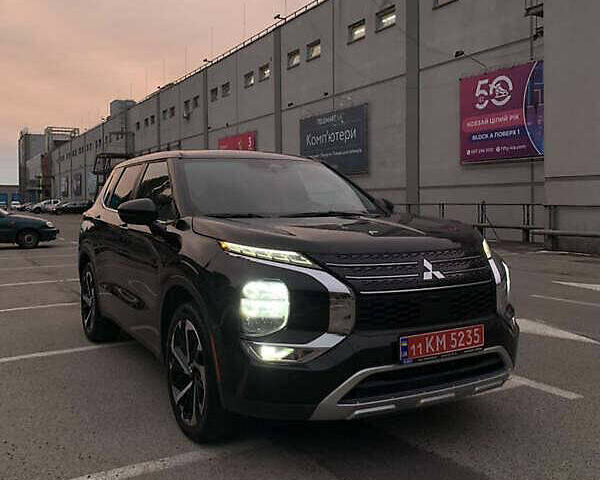 Черный Мицубиси Аутлендер, объемом двигателя 2.49 л и пробегом 70 тыс. км за 21000 $, фото 1 на Automoto.ua