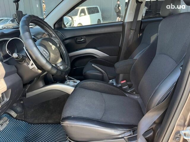 Мицубиси Аутлендер 2010 в Львове на Automoto.ua Коричневый Мицубиси Аутлендер, объемом двигателя 2.4 л и пробегом 303 тыс. км за 8990 $, фото 32 на Automoto.ua