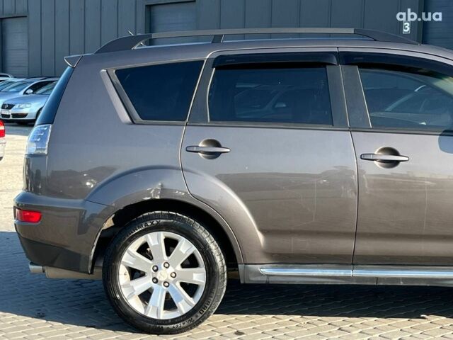 Мицубиси Аутлендер 2010 в Львове на Automoto.ua Коричневый Мицубиси Аутлендер, объемом двигателя 2.4 л и пробегом 303 тыс. км за 8990 $, фото 41 на Automoto.ua