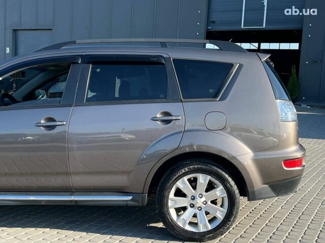 Мицубиси Аутлендер 2010 в Львове на Automoto.ua Коричневый Мицубиси Аутлендер, объемом двигателя 2.4 л и пробегом 303 тыс. км за 8990 $, фото 37 на Automoto.ua