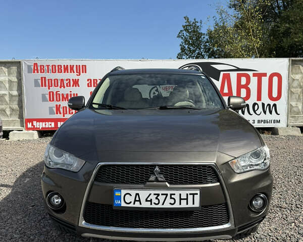 Коричневий Міцубісі Аутлендер, об'ємом двигуна 3 л та пробігом 211 тис. км за 10900 $, фото 1 на Automoto.ua