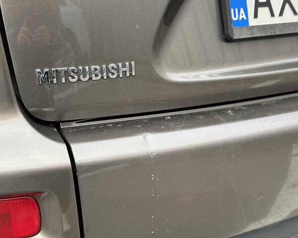 Коричневый Мицубиси Аутлендер, объемом двигателя 2.36 л и пробегом 191 тыс. км за 10900 $, фото 11 на Automoto.ua