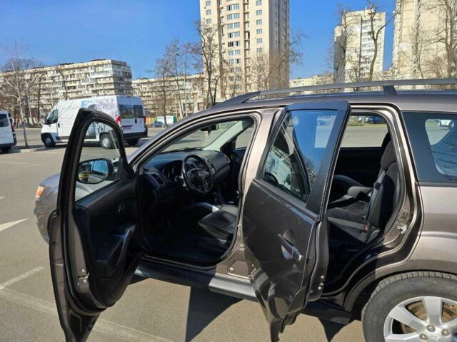 Коричневый Мицубиси Аутлендер, объемом двигателя 2.4 л и пробегом 270 тыс. км за 10300 $, фото 1 на Automoto.ua