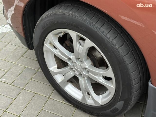 Коричневый Мицубиси Аутлендер, объемом двигателя 2.4 л и пробегом 267 тыс. км за 11990 $, фото 6 на Automoto.ua