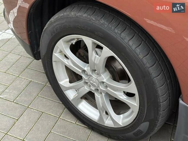Коричневий Міцубісі Аутлендер, об'ємом двигуна 2.4 л та пробігом 267 тис. км за 11990 $, фото 7 на Automoto.ua