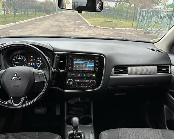 Коричневий Міцубісі Аутлендер, об'ємом двигуна 2.36 л та пробігом 197 тис. км за 14000 $, фото 17 на Automoto.ua