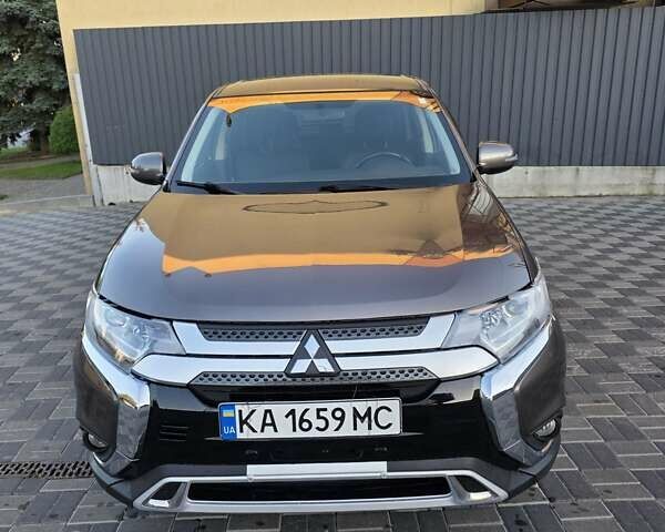 Коричневий Міцубісі Аутлендер, об'ємом двигуна 2.4 л та пробігом 129 тис. км за 12999 $, фото 6 на Automoto.ua