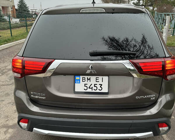 Коричневий Міцубісі Аутлендер, об'ємом двигуна 2.36 л та пробігом 197 тис. км за 14000 $, фото 10 на Automoto.ua