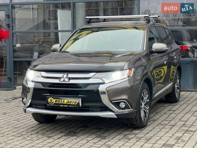 Коричневый Мицубиси Аутлендер, объемом двигателя 2.36 л и пробегом 160 тыс. км за 15000 $, фото 2 на Automoto.ua