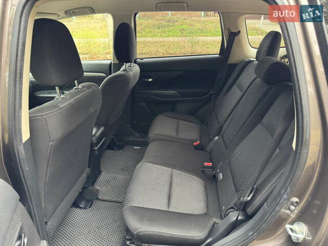 Коричневий Міцубісі Аутлендер, об'ємом двигуна 2.36 л та пробігом 167 тис. км за 12500 $, фото 7 на Automoto.ua