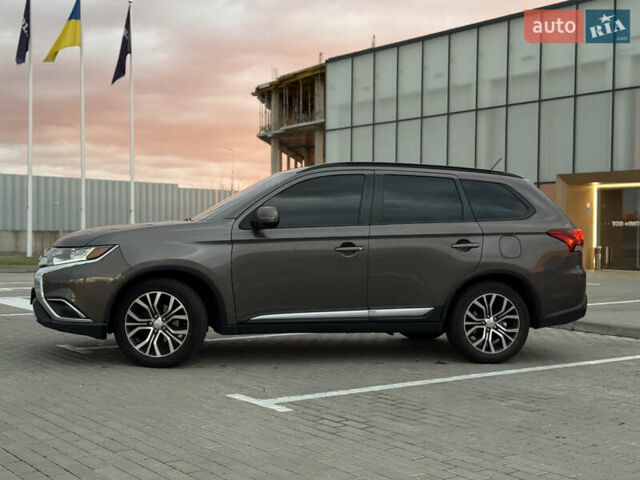 Коричневый Мицубиси Аутлендер, объемом двигателя 2.36 л и пробегом 188 тыс. км за 13000 $, фото 3 на Automoto.ua