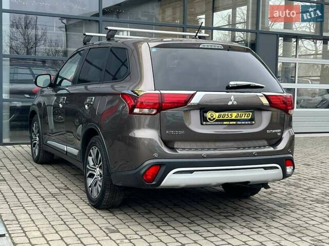 Коричневый Мицубиси Аутлендер, объемом двигателя 2.36 л и пробегом 160 тыс. км за 15000 $, фото 4 на Automoto.ua