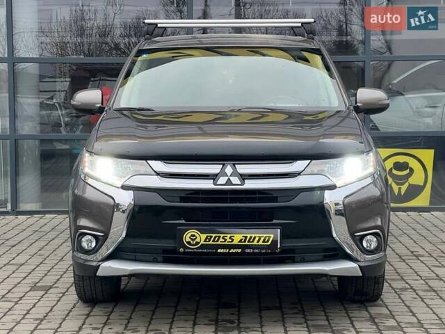 Коричневый Мицубиси Аутлендер, объемом двигателя 2.36 л и пробегом 160 тыс. км за 15000 $, фото 1 на Automoto.ua