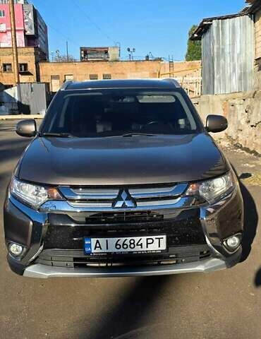 Коричневый Мицубиси Аутлендер, объемом двигателя 2.36 л и пробегом 168 тыс. км за 16500 $, фото 1 на Automoto.ua