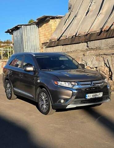 Коричневый Мицубиси Аутлендер, объемом двигателя 2.36 л и пробегом 168 тыс. км за 16500 $, фото 2 на Automoto.ua