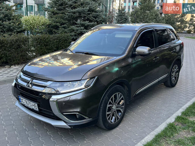 Коричневий Міцубісі Аутлендер, об'ємом двигуна 2.36 л та пробігом 170 тис. км за 16500 $, фото 2 на Automoto.ua