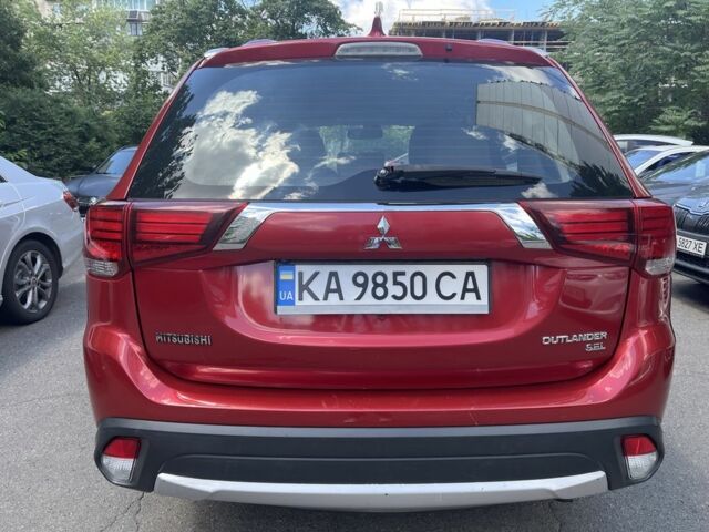 Красный Мицубиси Аутлендер, объемом двигателя 2.36 л и пробегом 160 тыс. км за 14000 $, фото 6 на Automoto.ua
