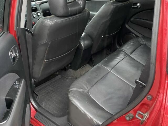 Красный Мицубиси Аутлендер, объемом двигателя 2.4 л и пробегом 293 тыс. км за 3595 $, фото 5 на Automoto.ua