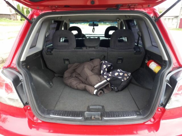 Красный Мицубиси Аутлендер, объемом двигателя 2 л и пробегом 217 тыс. км за 6250 $, фото 5 на Automoto.ua