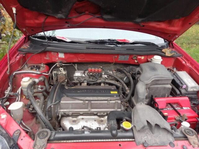 Красный Мицубиси Аутлендер, объемом двигателя 2 л и пробегом 217 тыс. км за 6250 $, фото 7 на Automoto.ua