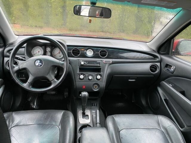 Красный Мицубиси Аутлендер, объемом двигателя 2.4 л и пробегом 293 тыс. км за 3595 $, фото 7 на Automoto.ua