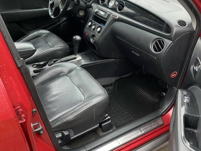 Красный Мицубиси Аутлендер, объемом двигателя 2.4 л и пробегом 293 тыс. км за 3595 $, фото 3 на Automoto.ua