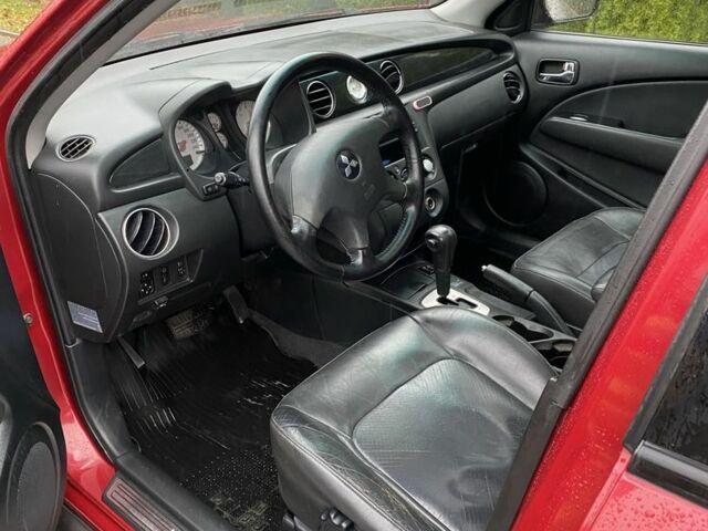 Красный Мицубиси Аутлендер, объемом двигателя 2.4 л и пробегом 293 тыс. км за 3595 $, фото 6 на Automoto.ua