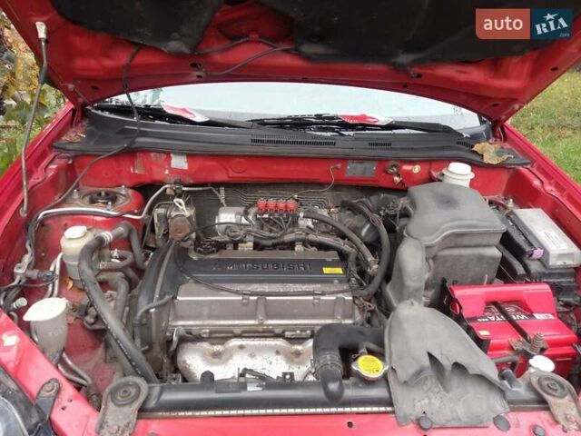 Красный Мицубиси Аутлендер, объемом двигателя 2 л и пробегом 217 тыс. км за 6250 $, фото 6 на Automoto.ua