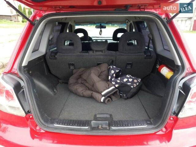 Красный Мицубиси Аутлендер, объемом двигателя 2 л и пробегом 217 тыс. км за 6250 $, фото 4 на Automoto.ua