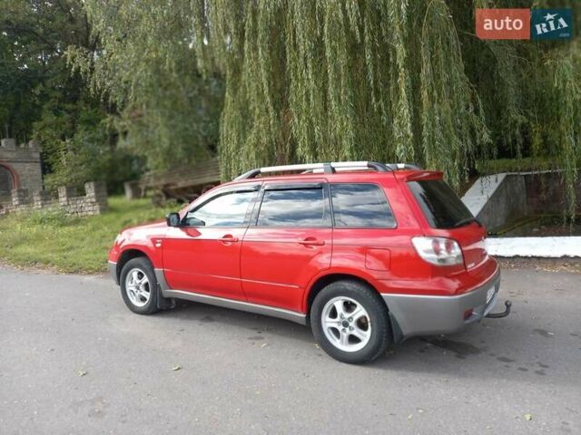 Красный Мицубиси Аутлендер, объемом двигателя 2 л и пробегом 217 тыс. км за 6250 $, фото 7 на Automoto.ua