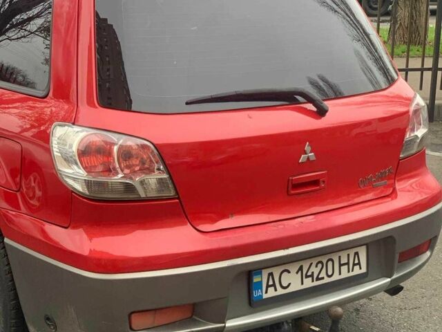 Красный Мицубиси Аутлендер, объемом двигателя 2 л и пробегом 344 тыс. км за 4300 $, фото 8 на Automoto.ua