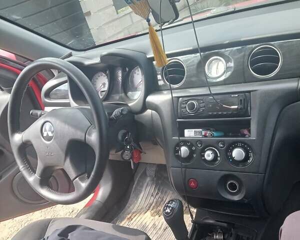 Червоний Міцубісі Аутлендер, об'ємом двигуна 2.38 л та пробігом 299 тис. км за 4200 $, фото 4 на Automoto.ua