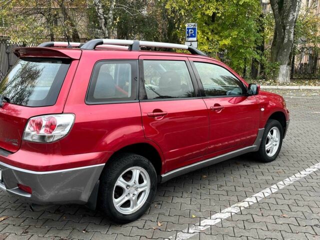 Красный Мицубиси Аутлендер, объемом двигателя 2.4 л и пробегом 174 тыс. км за 6900 $, фото 7 на Automoto.ua