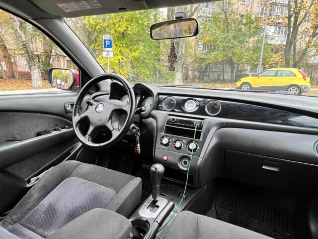 Красный Мицубиси Аутлендер, объемом двигателя 2.4 л и пробегом 174 тыс. км за 6900 $, фото 12 на Automoto.ua