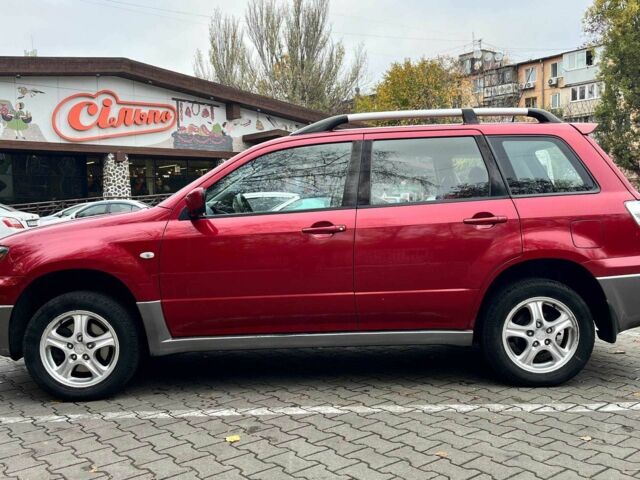 Красный Мицубиси Аутлендер, объемом двигателя 2.4 л и пробегом 174 тыс. км за 6900 $, фото 6 на Automoto.ua