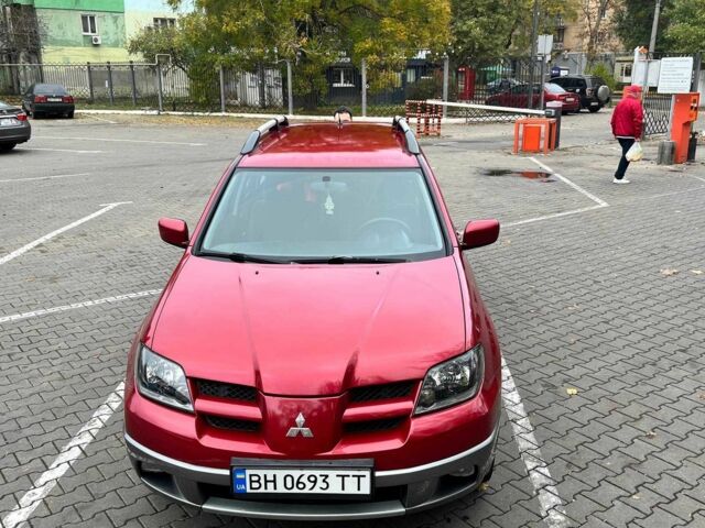 Красный Мицубиси Аутлендер, объемом двигателя 2.4 л и пробегом 174 тыс. км за 6900 $, фото 4 на Automoto.ua