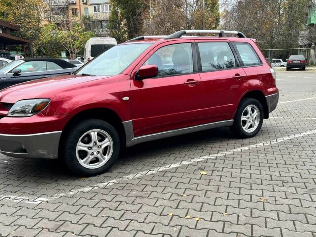 Красный Мицубиси Аутлендер, объемом двигателя 2.4 л и пробегом 174 тыс. км за 6900 $, фото 5 на Automoto.ua