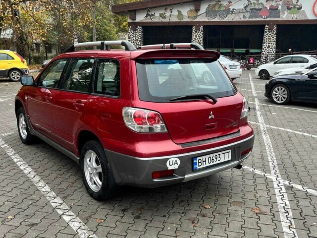 Красный Мицубиси Аутлендер, объемом двигателя 2.4 л и пробегом 174 тыс. км за 6900 $, фото 8 на Automoto.ua