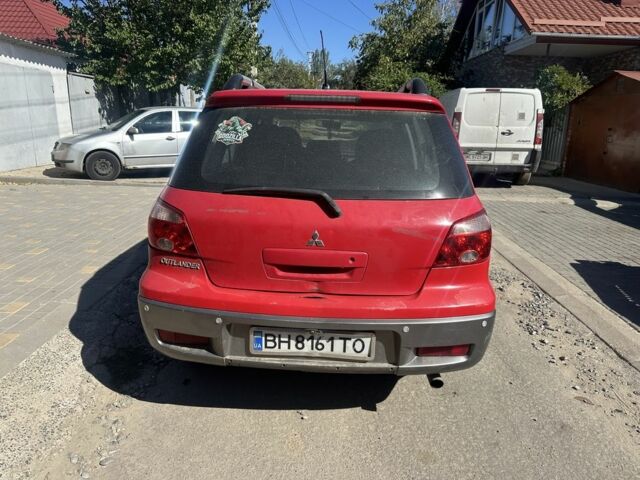 Червоний Міцубісі Аутлендер, об'ємом двигуна 2.4 л та пробігом 235 тис. км за 3999 $, фото 2 на Automoto.ua