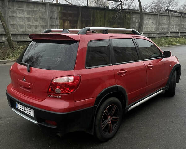 Красный Мицубиси Аутлендер, объемом двигателя 2.4 л и пробегом 224 тыс. км за 5600 $, фото 6 на Automoto.ua