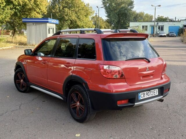 Мицубиси Аутлендер 2006 в Чернигове на Automoto.ua Красный Мицубиси Аутлендер, объемом двигателя 2.4 л и пробегом 220 тыс. км за 5499 $, фото 3 на Automoto.ua